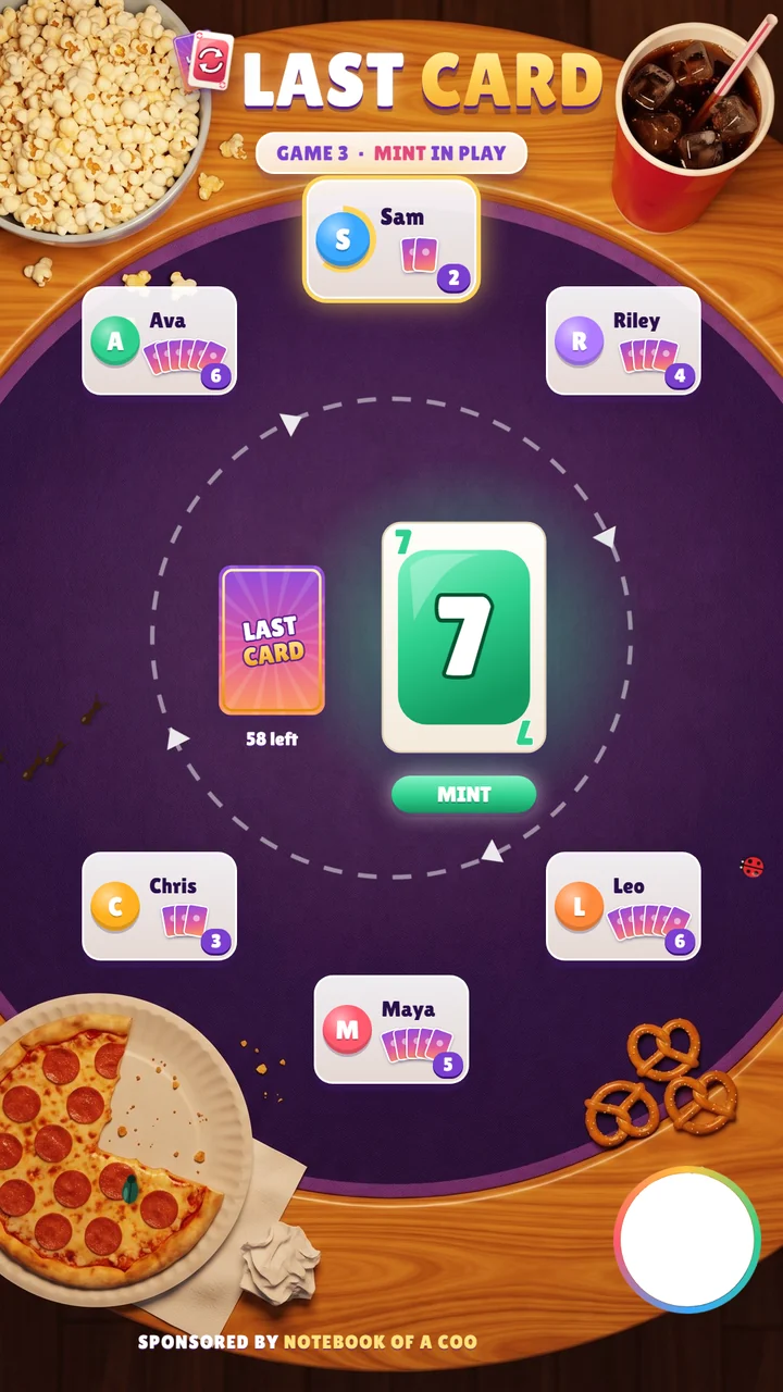 The Last Card LIVE screen on a game night table with popcorn and pizza: the pile and the deck in the middle, the players' seats with their card counts around them, and the host camera circle in the corner